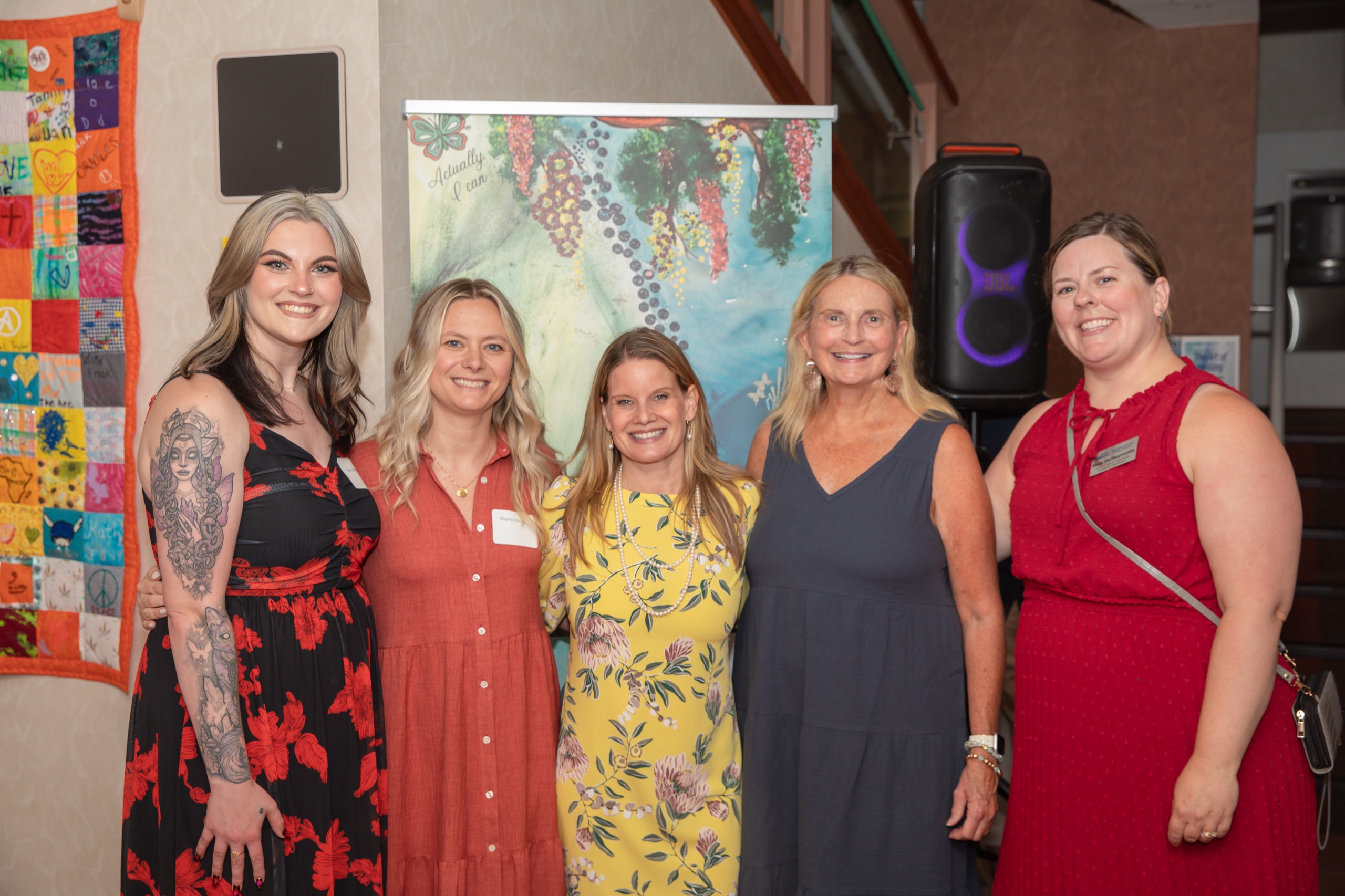 Group of friends posing together at a community event