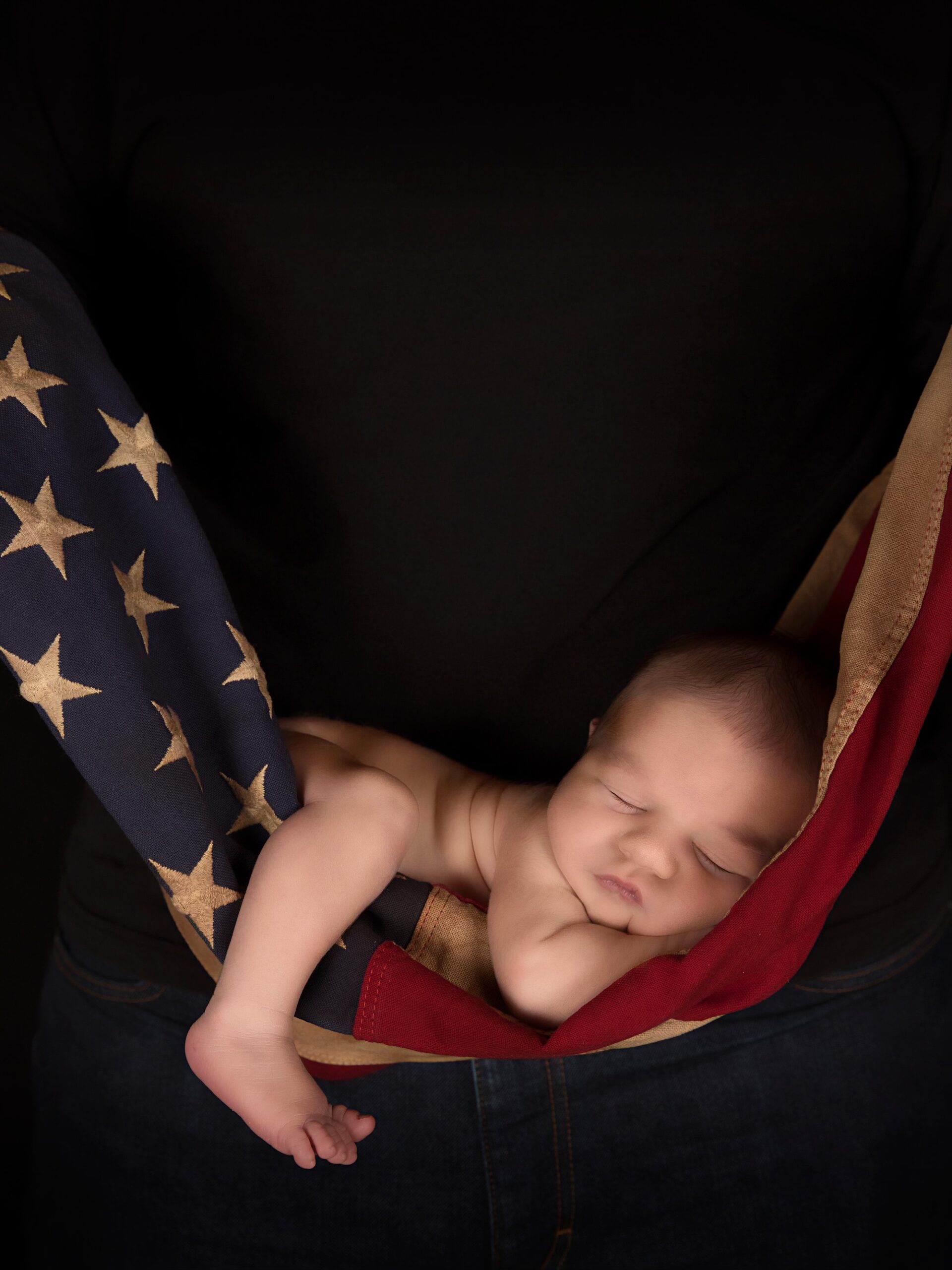 Newborn wrapped in an American flag